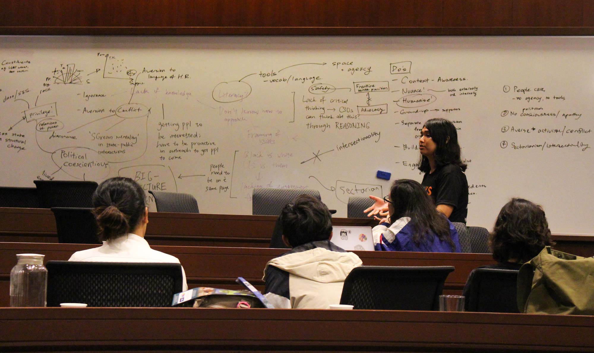 photo of a student activist sharing their breakout group's discussion during the All Talk, How Action workshop
